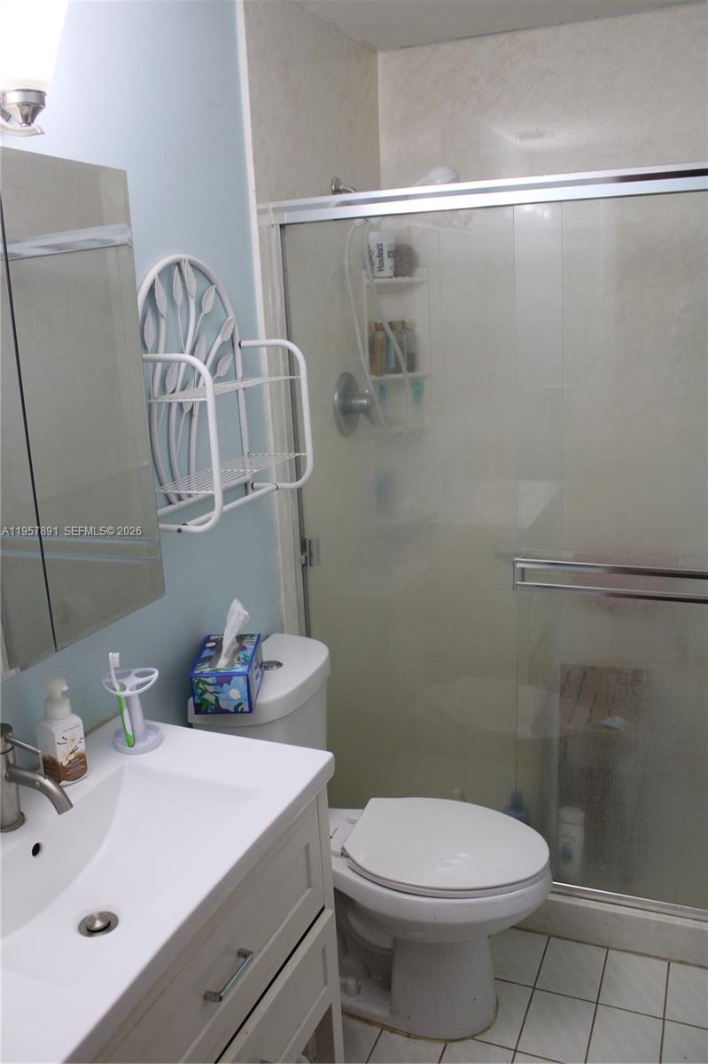 12965 Southwest 76th Terrace Miami, FL 33183 - Photo 24 of 29 a bathroom with a sink a toilet and shower