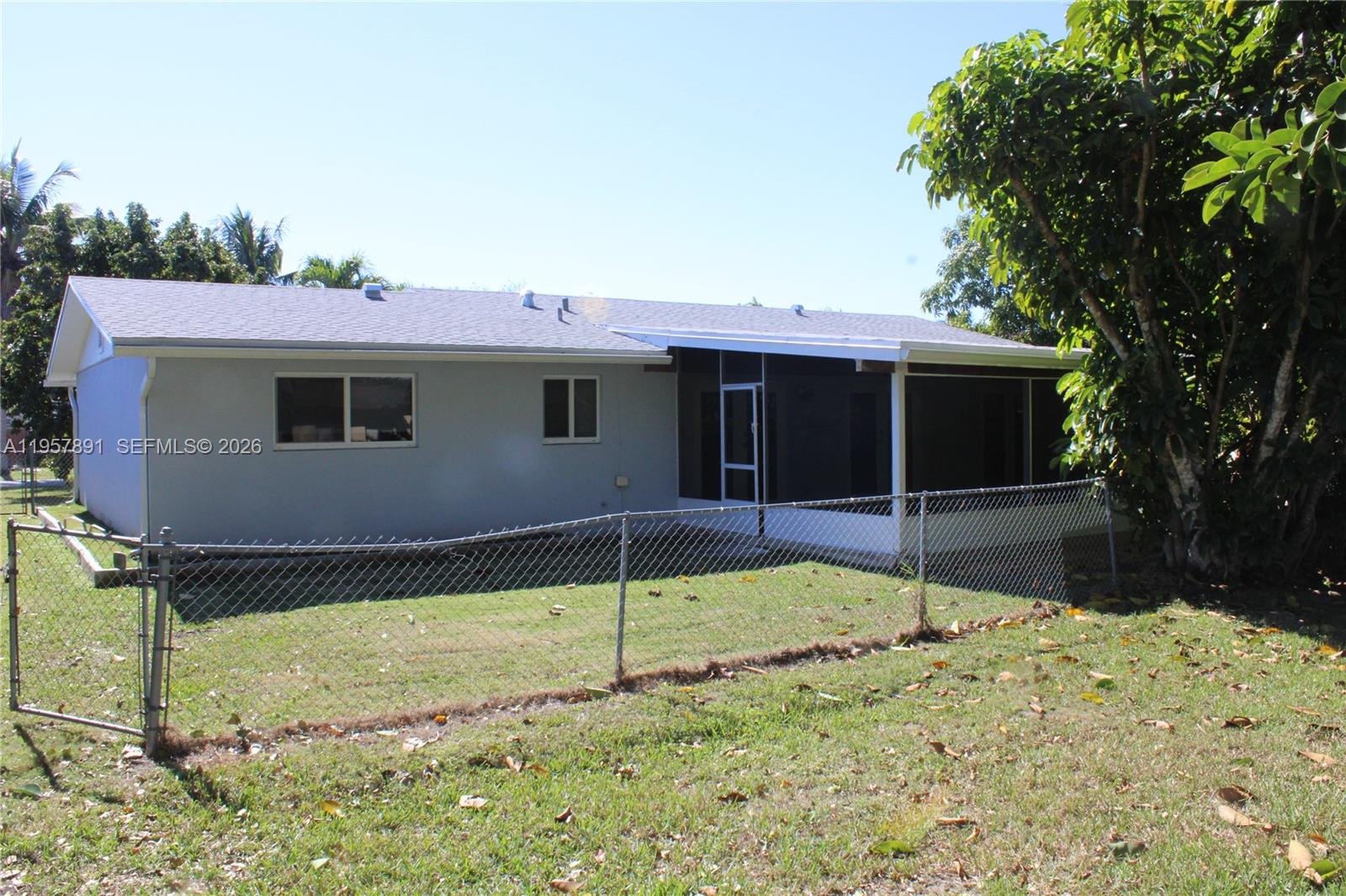 12965 Southwest 76th Terrace Miami, FL 33183 - Photo 7 of 29 a backyard of a house