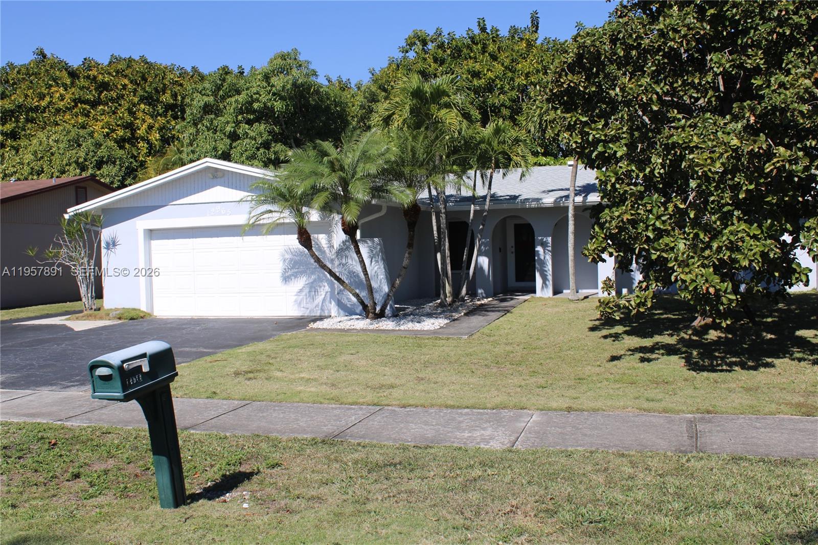 12965 Southwest 76th Terrace Miami, FL 33183 - Photo 8 of 29 a view of a backyard with a tree