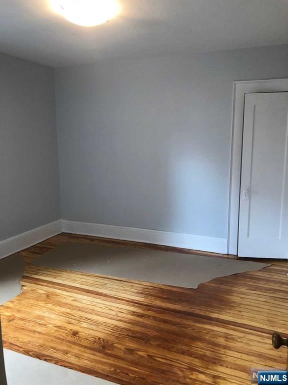 15 East Van Ness Avenue, Unit 1 Rutherford, NJ 07070 - Photo 13 of 25 a view of a room with wooden floor
