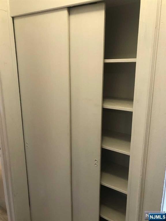 15 East Van Ness Avenue, Unit 1 Rutherford, NJ 07070 - Photo 17 of 25 a view of walk in closet with empty racks