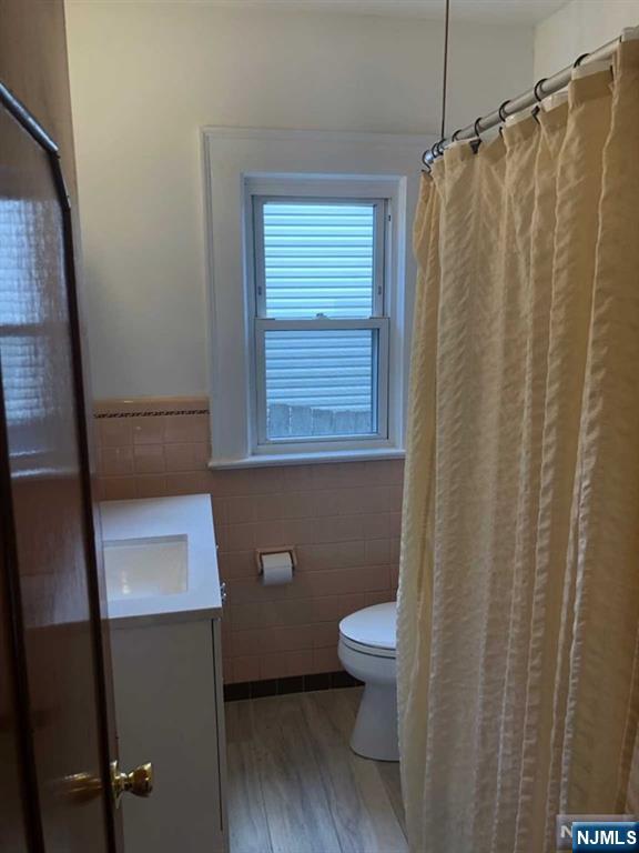 15 East Van Ness Avenue, Unit 1 Rutherford, NJ 07070 - Photo 18 of 25 a bathroom with a toilet and a shower