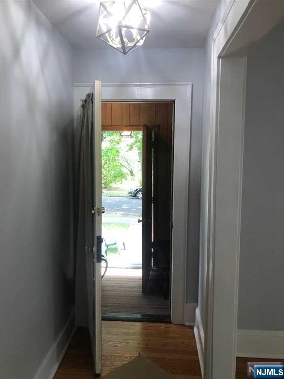 15 East Van Ness Avenue, Unit 1 Rutherford, NJ 07070 - Photo 3 of 25 a view of a hallway to a livingroom with furniture