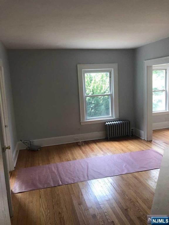 15 East Van Ness Avenue, Unit 1 Rutherford, NJ 07070 - Photo 5 of 25 a view of a room with wooden floor and window
