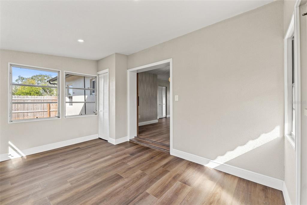 1173 Cobblestone Drive Spring Hill, FL 34606 - Photo 25 of 39 an empty room with wooden floor and windows