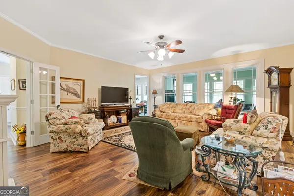 a living room with fireplace furniture and a flat screen tv