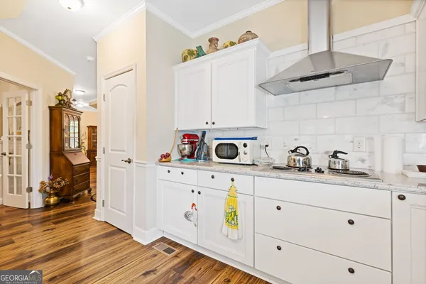 a kitchen with stainless steel appliances cabinets and a refrigerator