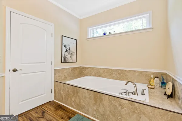 a view of a hallway with a room