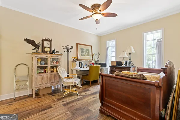 a living room with furniture a chandelier and a window
