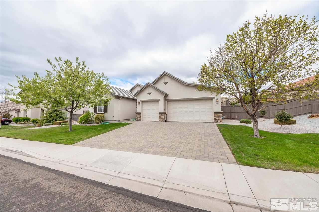 1065 South University Park Loop Reno, NV 89512 - Photo 1 of 20 a view of a house with a yard and large tree