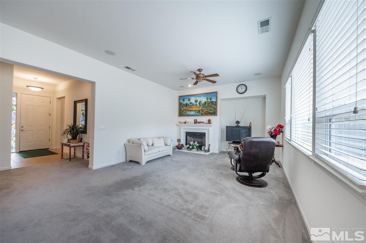 1065 South University Park Loop Reno, NV 89512 - Photo 4 of 20 a living room with furniture and a window