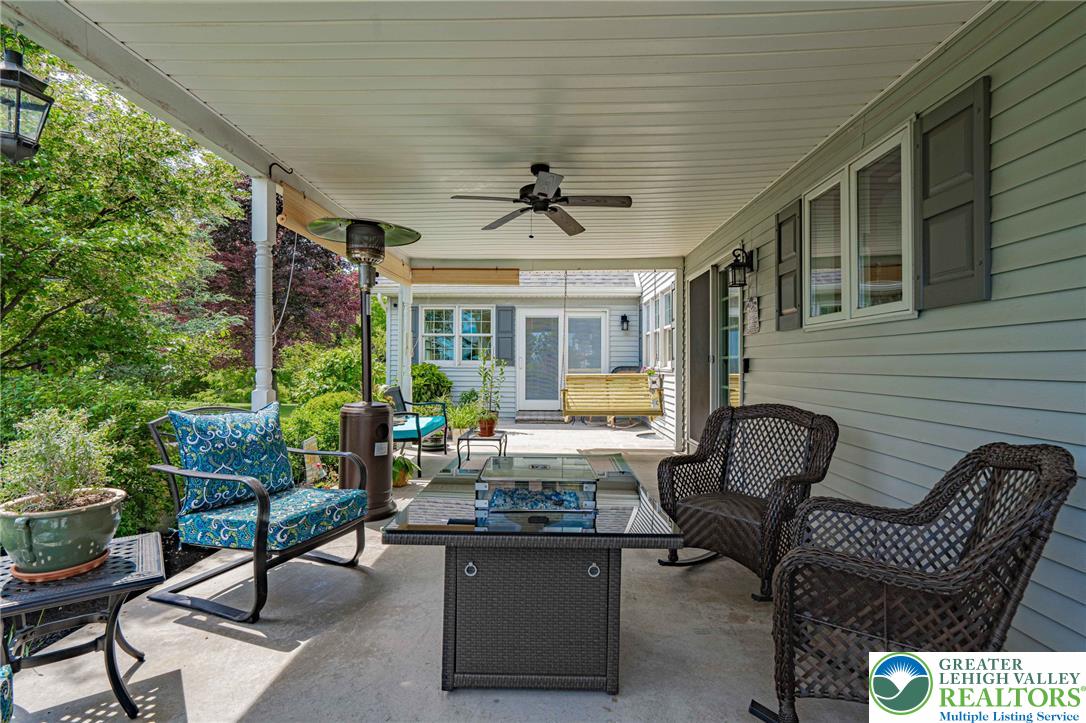 4542 Springfield Drive Coplay, PA 18037 - Photo 61 of 89 An inviting covered patio retreat with ample seating provides a perfect outdoor living space.