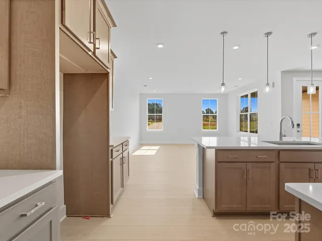 a view of a kitchen cabinets and wooden floor