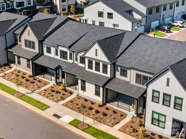 a car parked in front of a white building