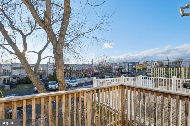 a view of a balcony with a tree