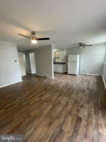 a view of a livingroom with wooden floor