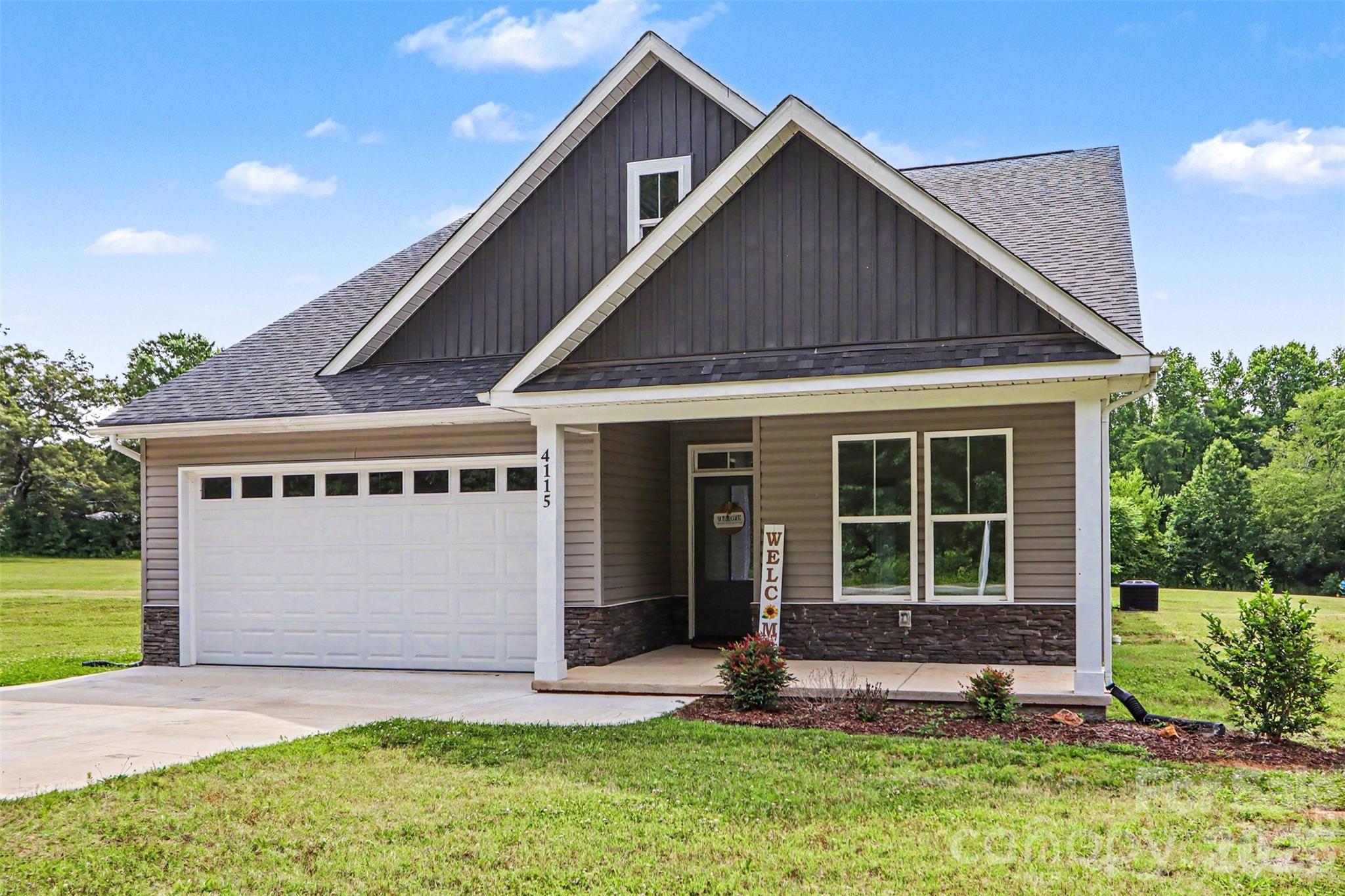 4115 Miller Road Salisbury, NC 28147 - Photo 1 of 26 a front view of a house with a yard and garage