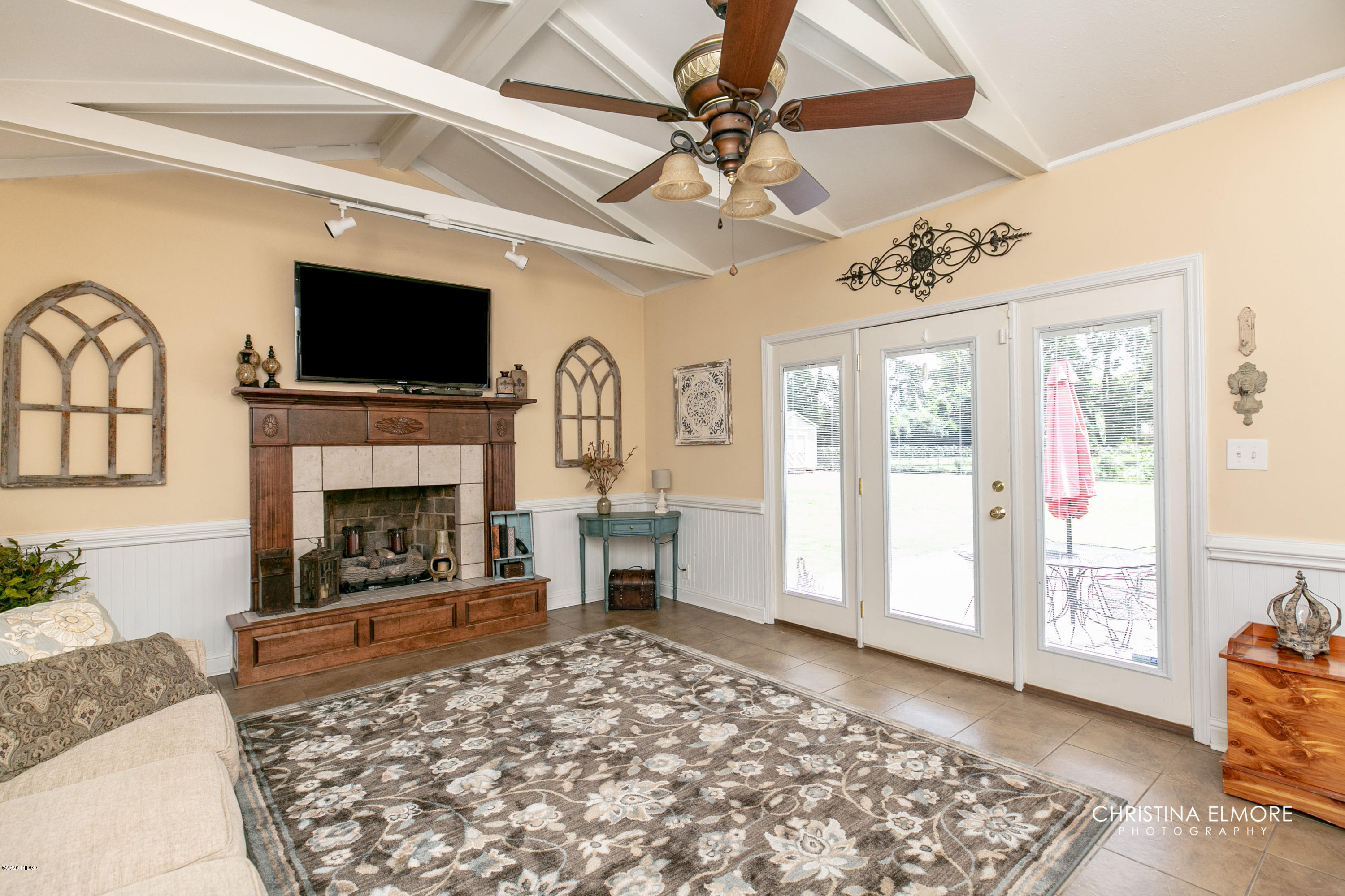 3673 Jones Road Macon, GA 31216 - Photo 2 of 34 a living room with furniture a flat screen tv and a fireplace