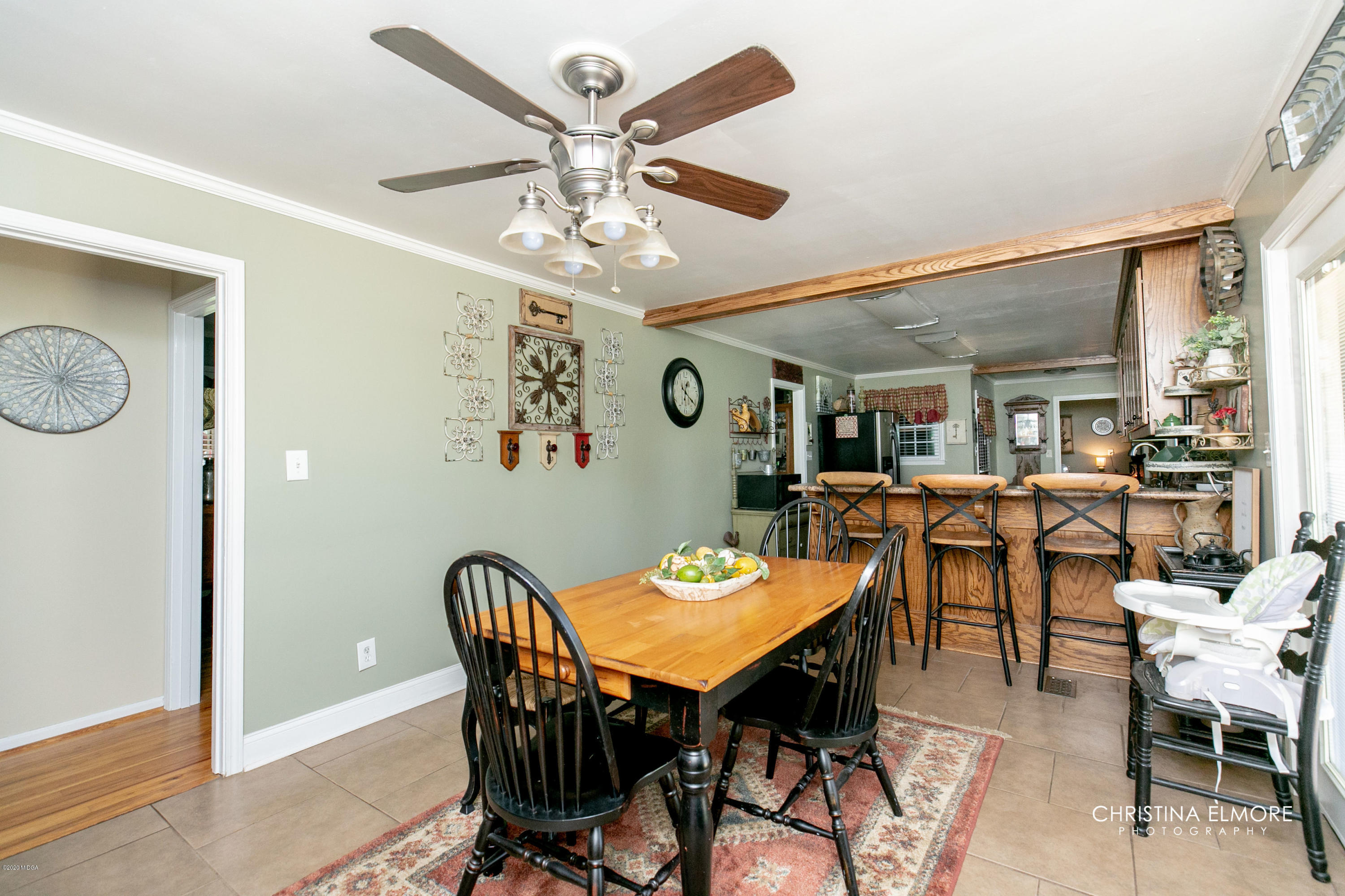 3673 Jones Road Macon, GA 31216 - Photo 17 of 34 a view of a dining room with furniture and a chandelier