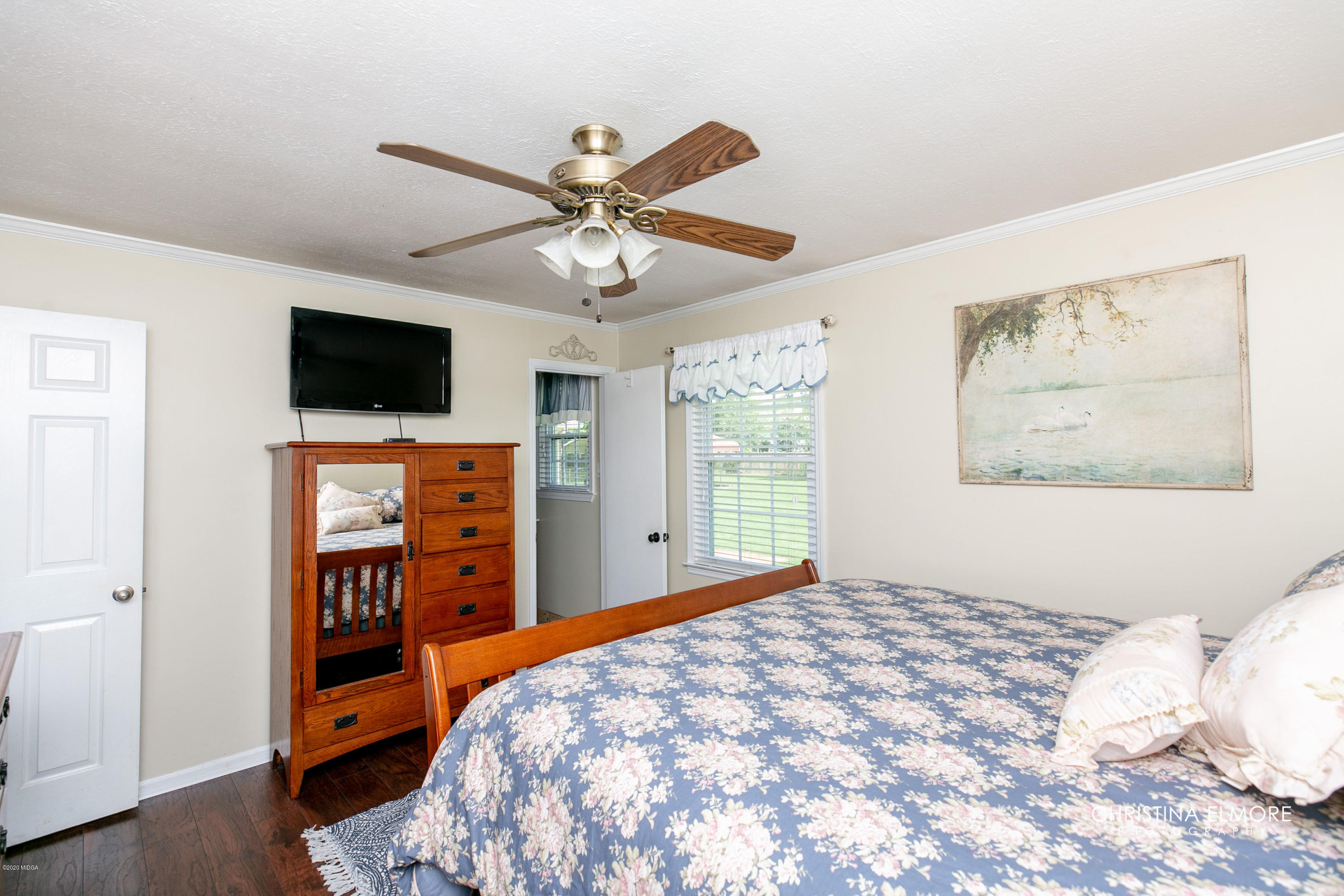 3673 Jones Road Macon, GA 31216 - Photo 20 of 34 a bedroom with a bed and a flat screen tv