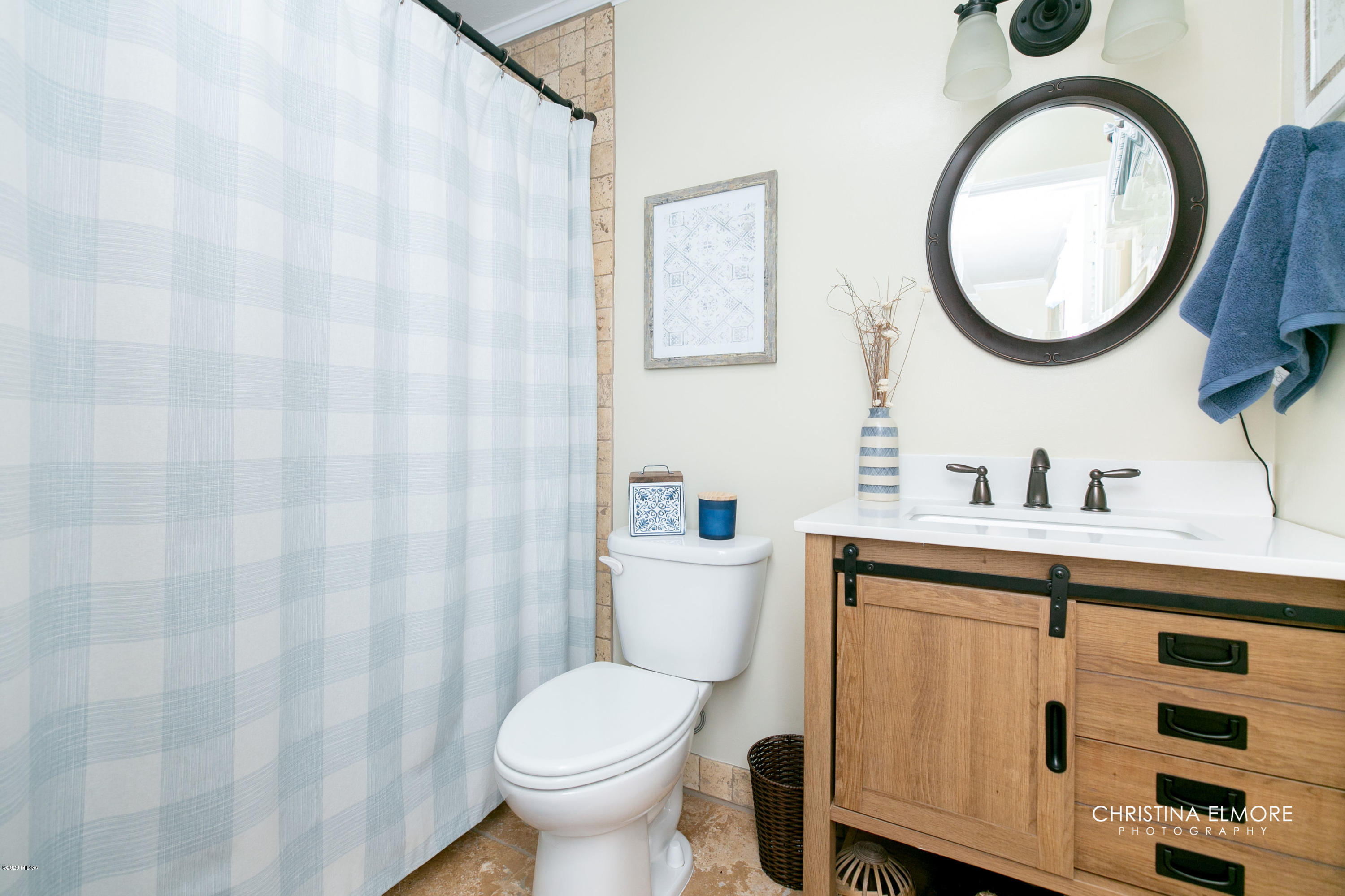 3673 Jones Road Macon, GA 31216 - Photo 22 of 34 a bathroom with a sink a toilet and a mirror