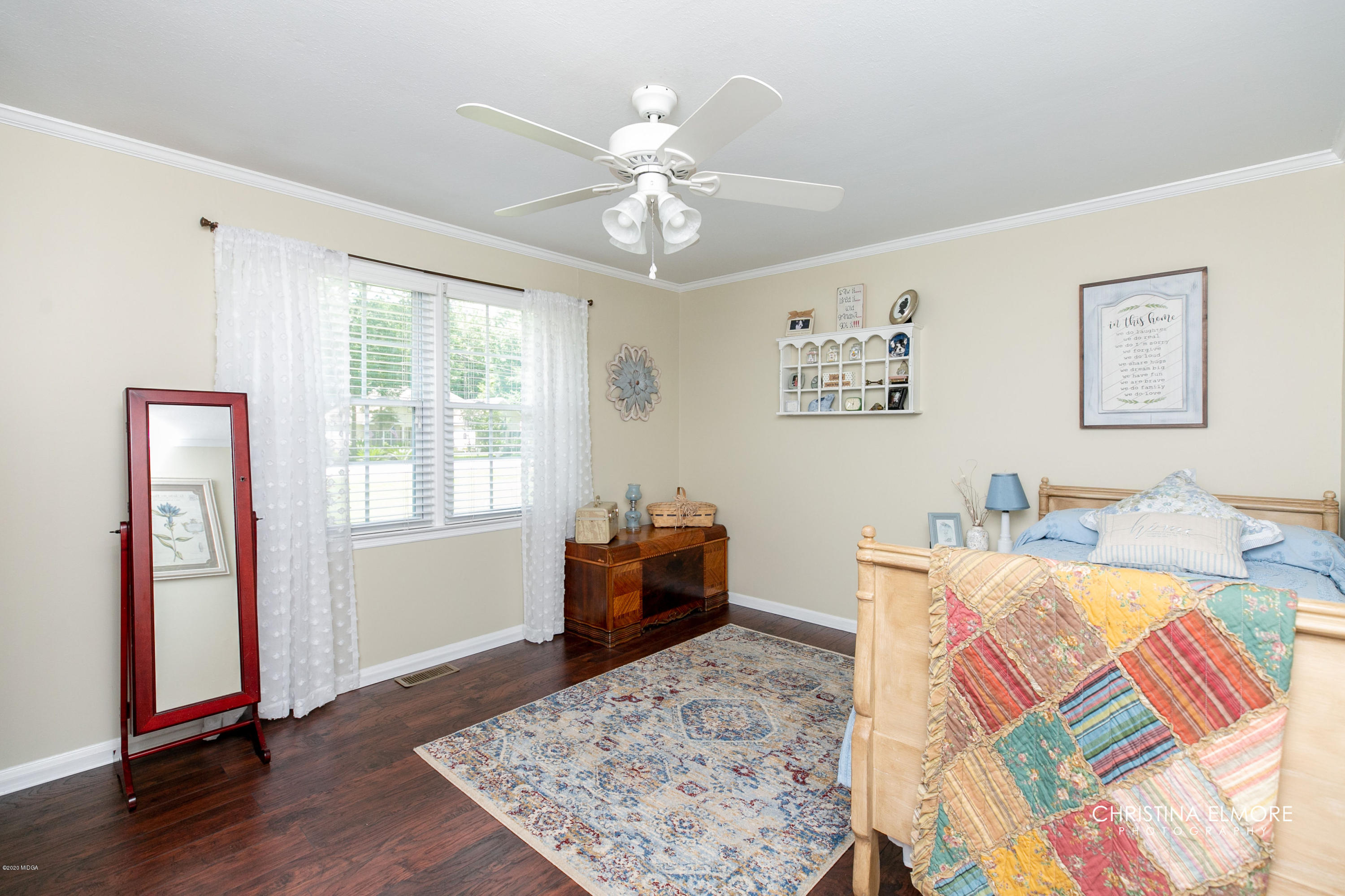 3673 Jones Road Macon, GA 31216 - Photo 23 of 34 a bed room with a bed and a chandelier