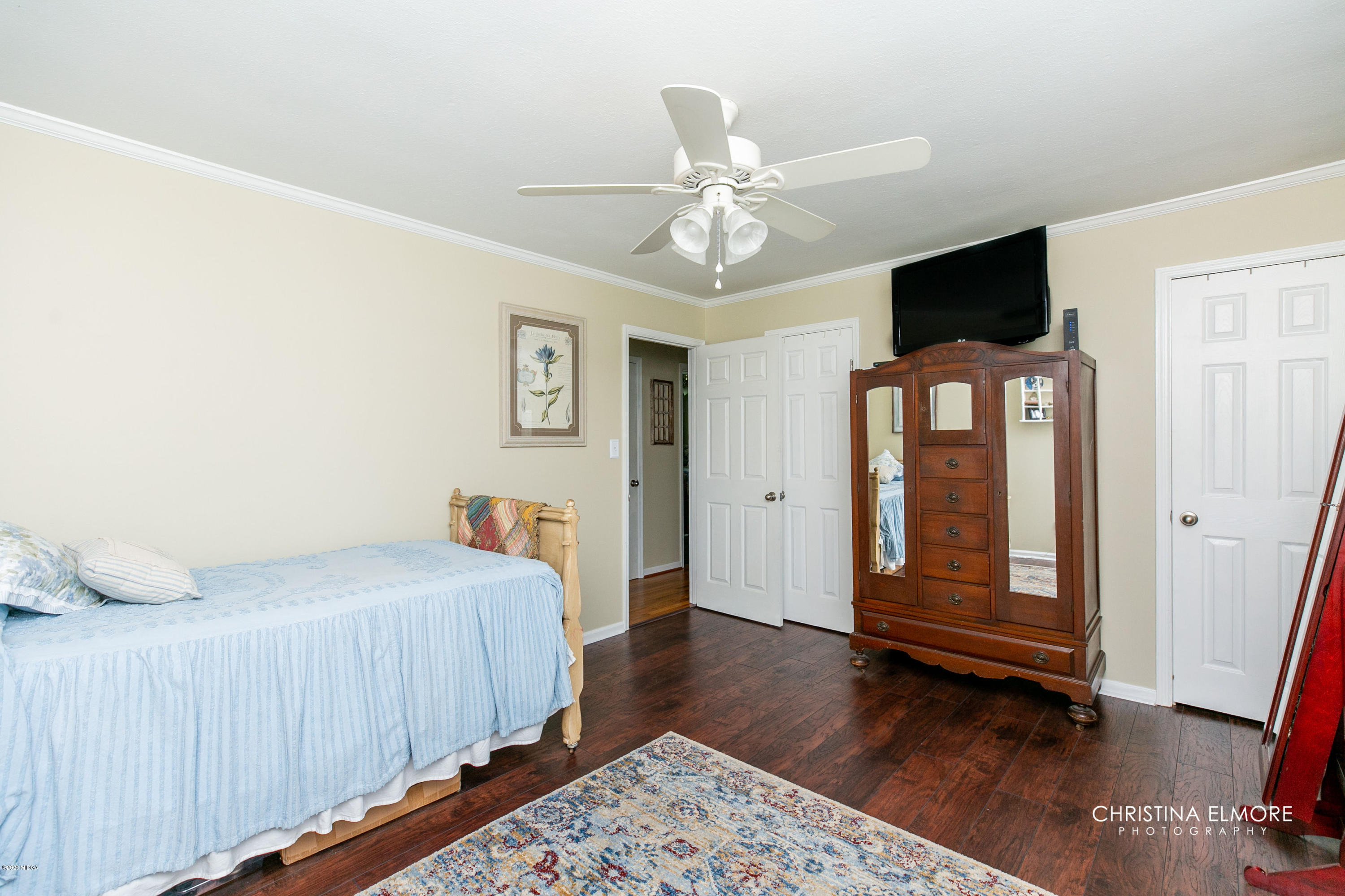 3673 Jones Road Macon, GA 31216 - Photo 25 of 34 a bedroom with a bed and wooden floor