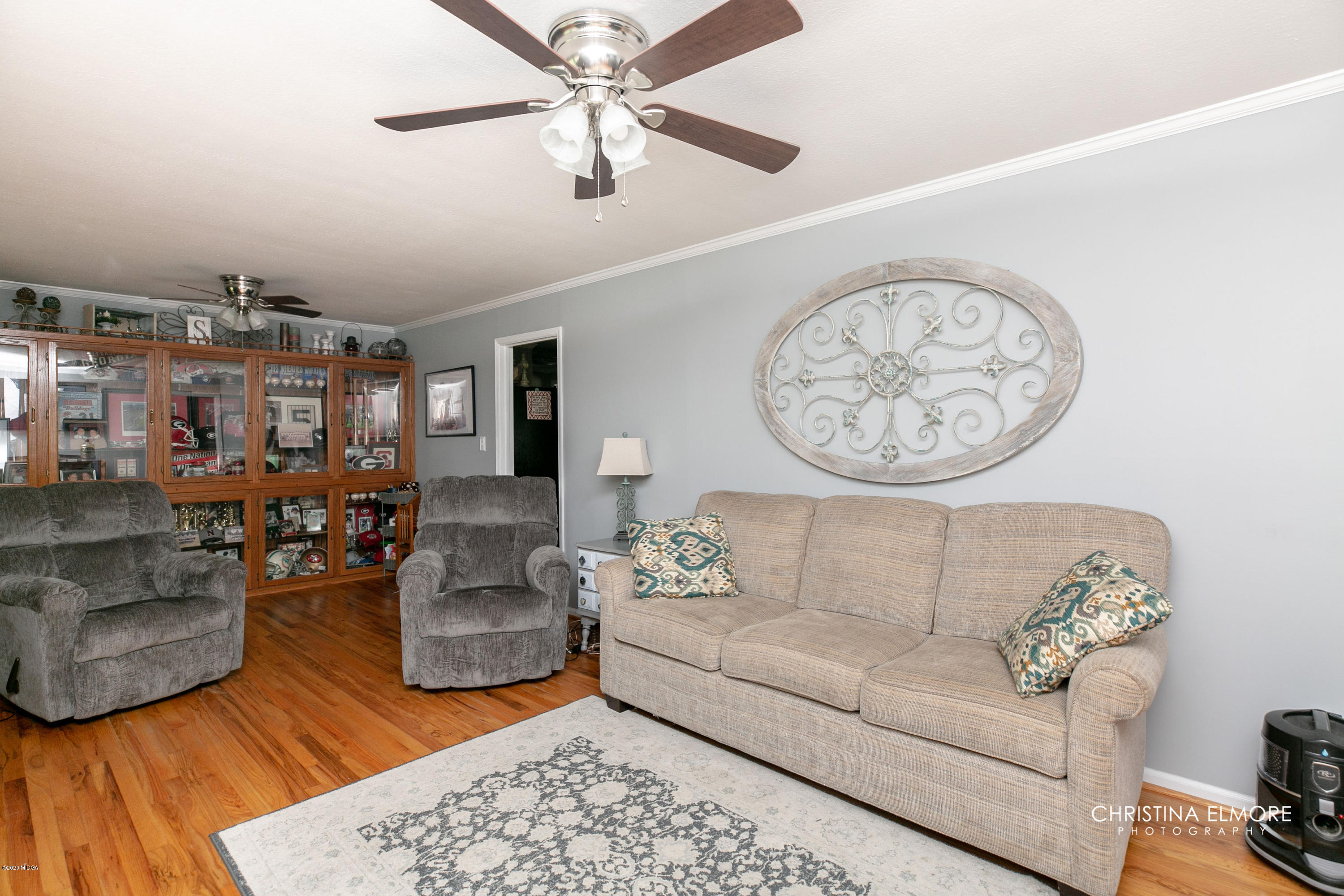 3673 Jones Road Macon, GA 31216 - Photo 7 of 34 a living room with furniture and a chandelier