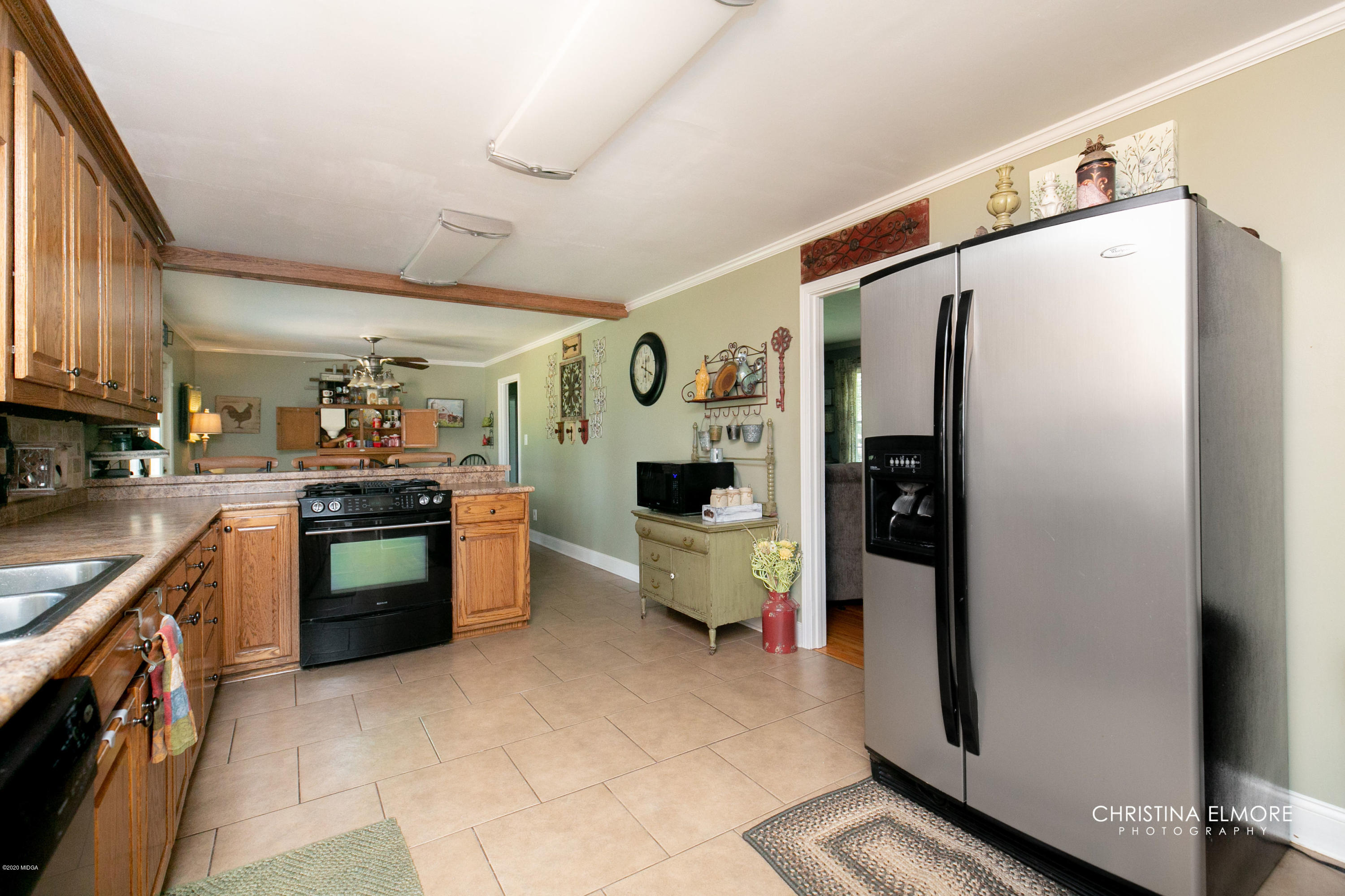 3673 Jones Road Macon, GA 31216 - Photo 9 of 34 a kitchen with stainless steel appliances a refrigerator sink and stove