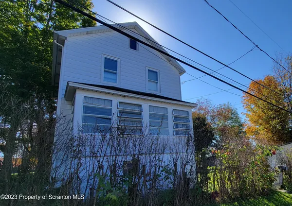 a brick building with a small yard