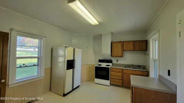 a kitchen with stainless steel appliances a stove and a refrigerator