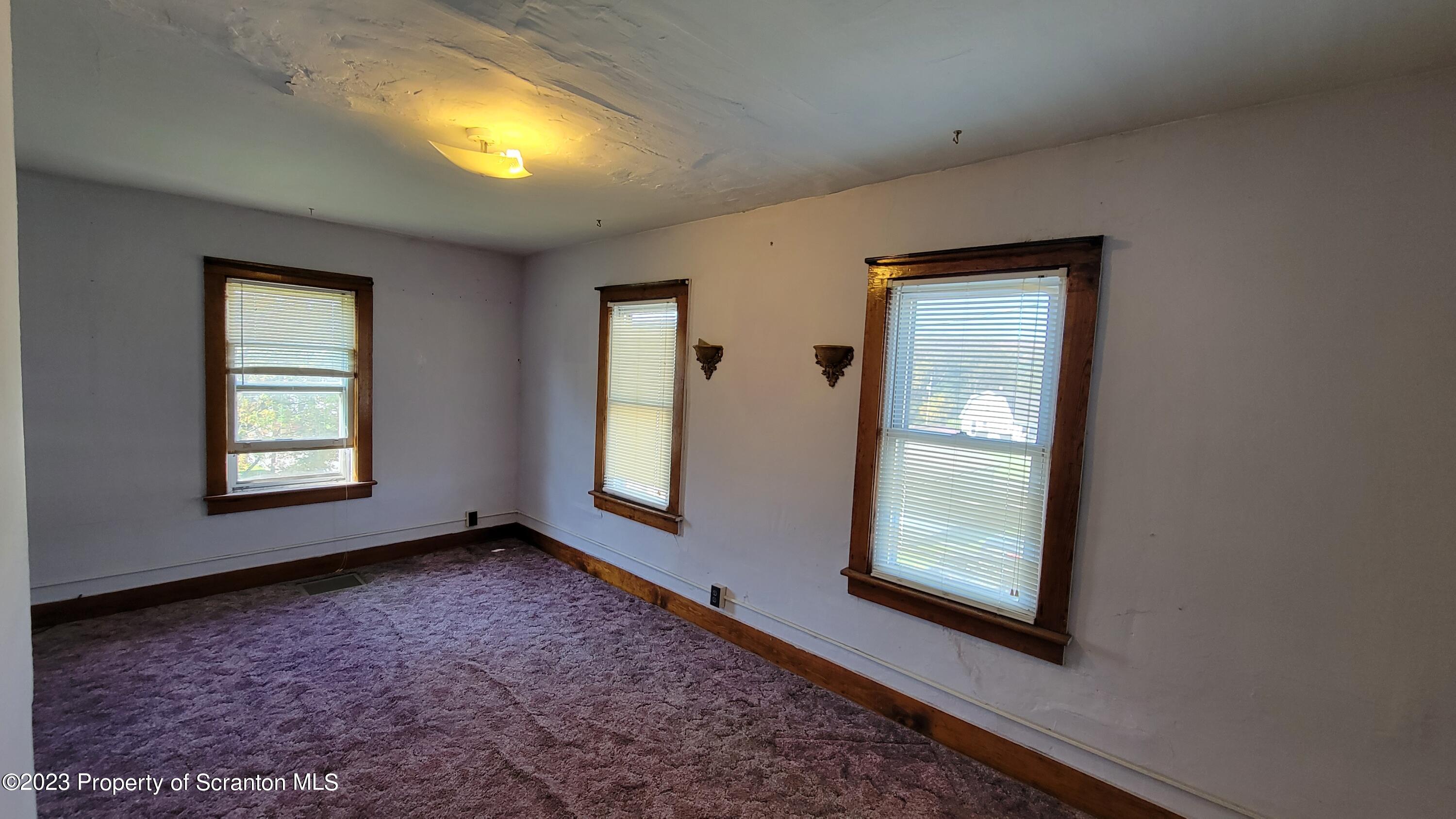 232 Vine Street Forest City, PA 18421 - Photo 13 of 24 an empty room with windows and closet