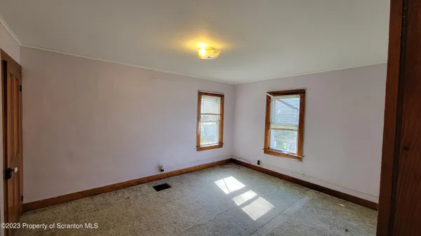 an empty room with windows