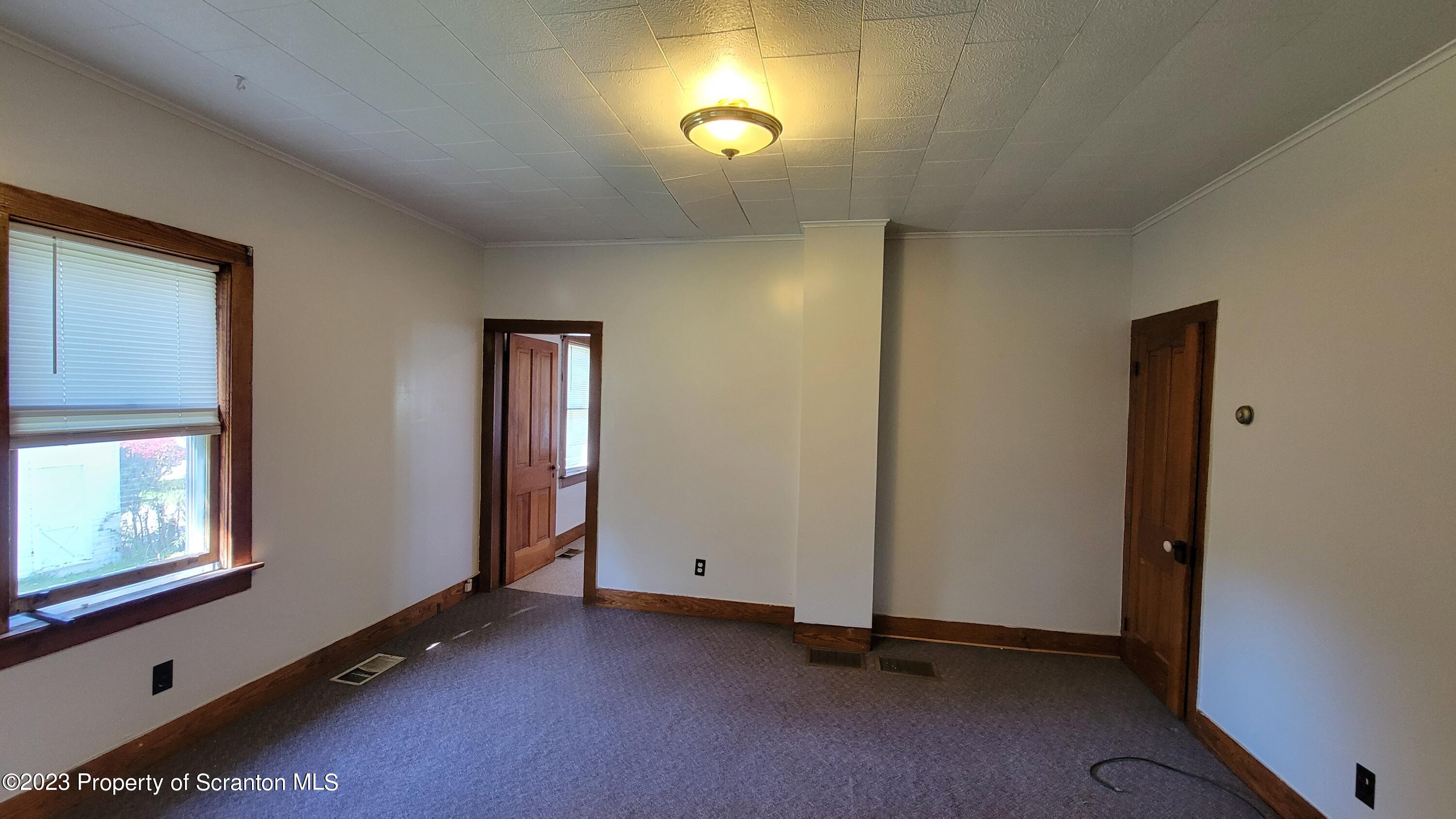 232 Vine Street Forest City, PA 18421 - Photo 17 of 24 a view of an empty room and window