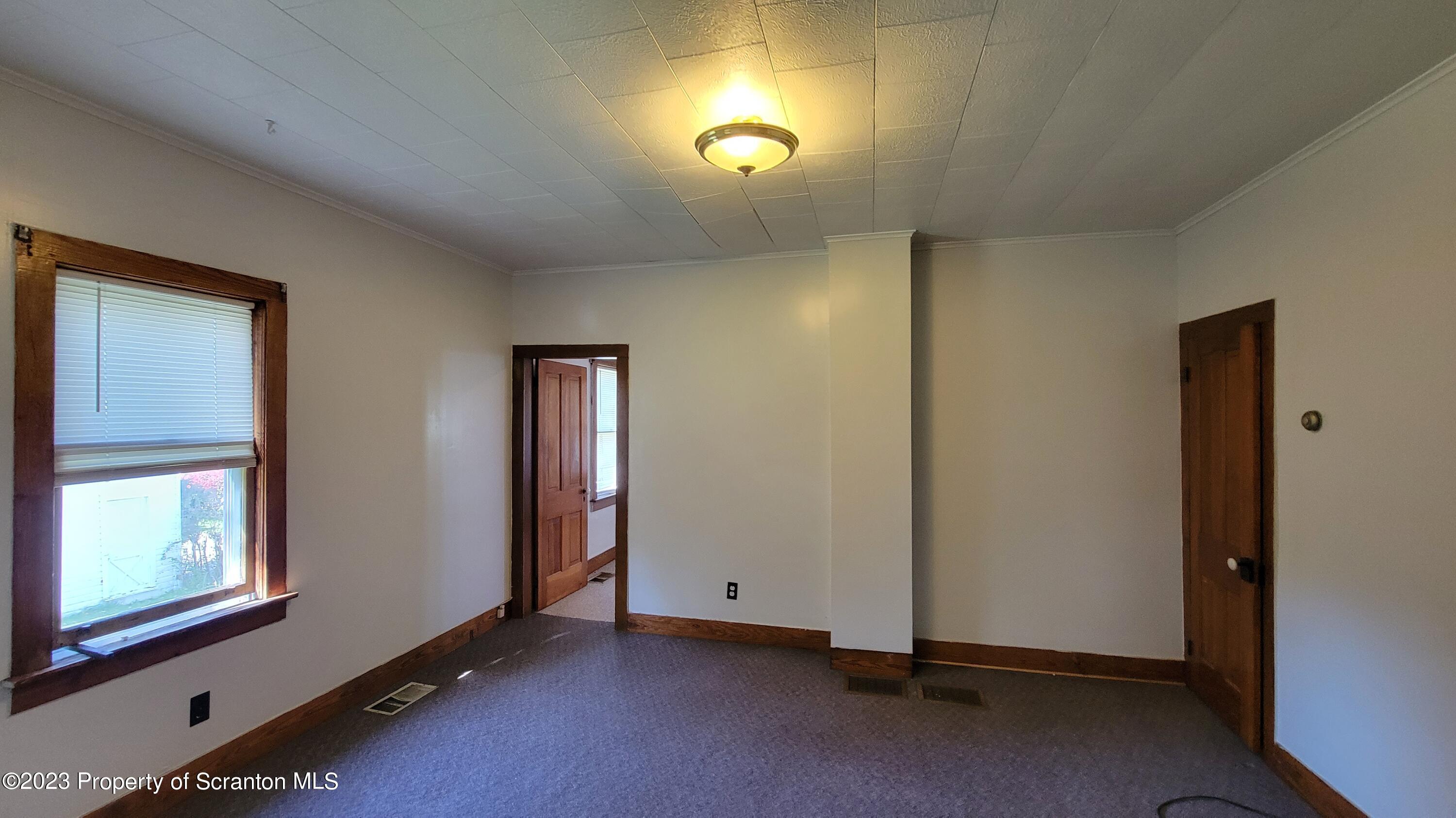 232 Vine Street Forest City, PA 18421 - Photo 19 of 24 an empty room with windows and closet