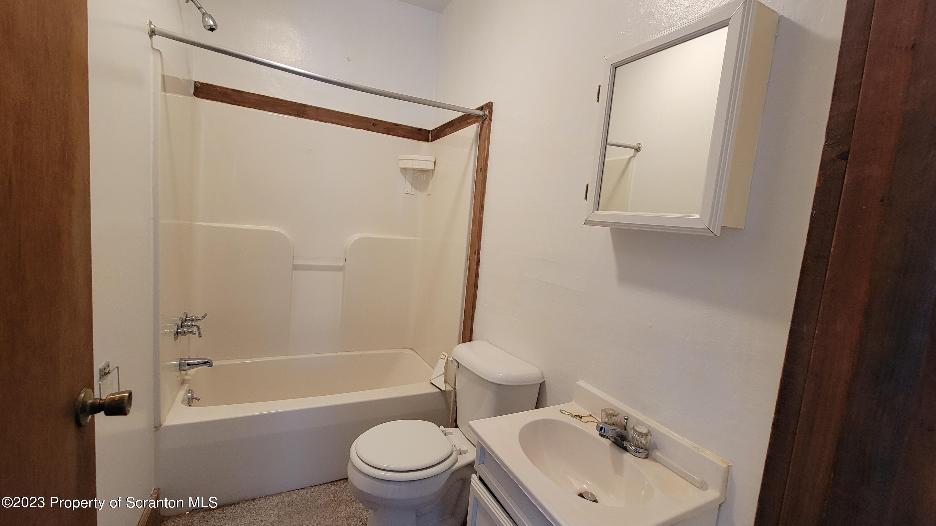 232 Vine Street Forest City, PA 18421 - Photo 22 of 24 a bathroom with a sink toilet and shower