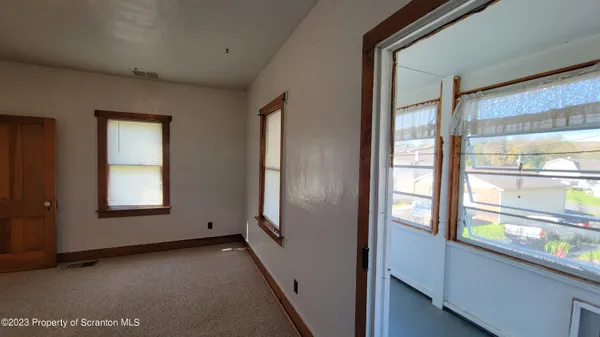 a view of empty room with windows