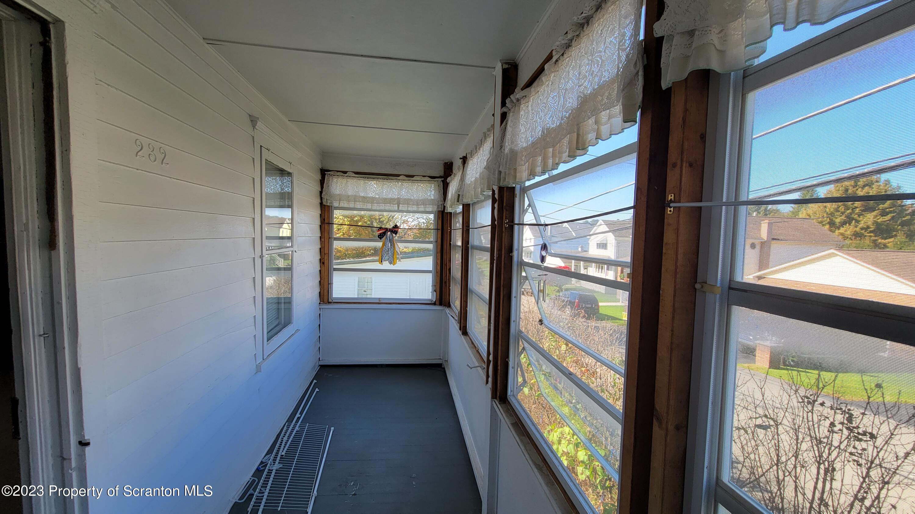 232 Vine Street Forest City, PA 18421 - Photo 24 of 24 a view of a glass door with a yard from a window