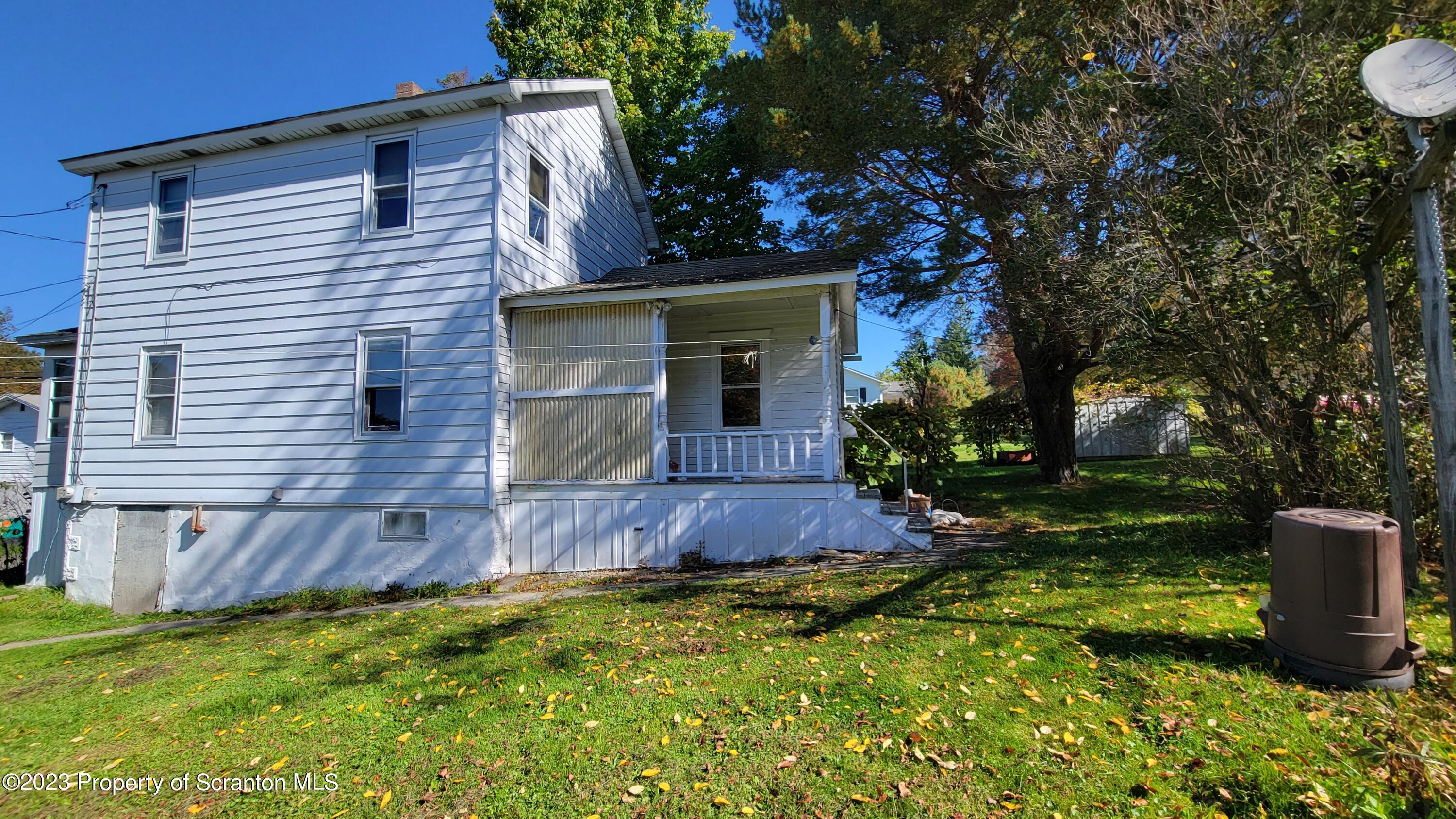 232 Vine Street Forest City, PA 18421 - Photo 5 of 24 a view of a house with a yard