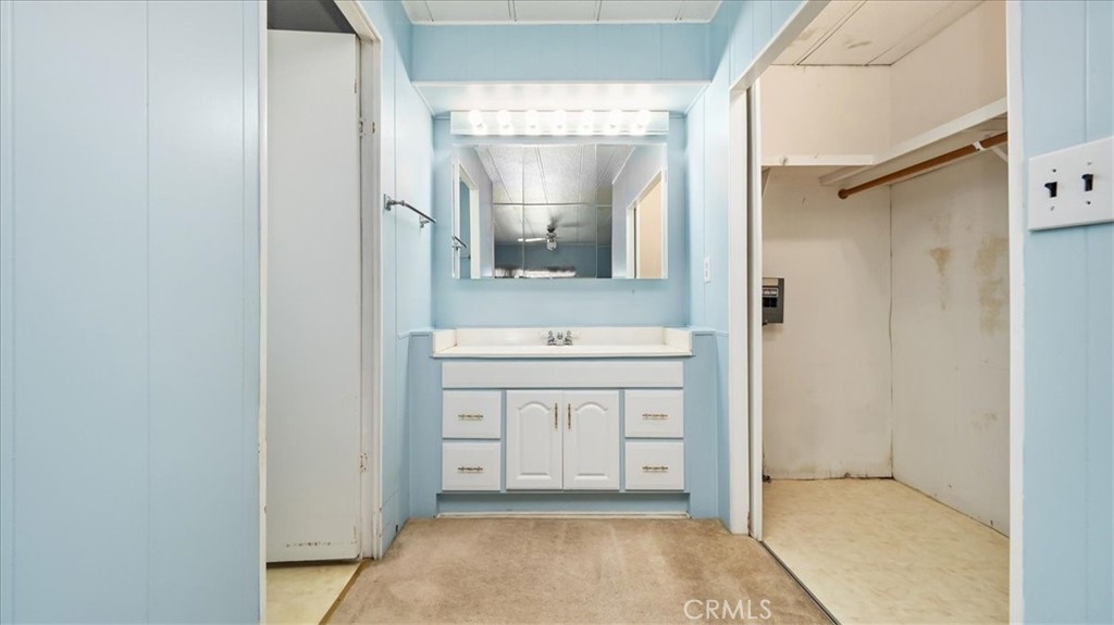 416 Jeffries, Unit 5 Monrovia, CA 91016 - Photo 14 of 20 a bathroom with a sink a mirror and a vanity