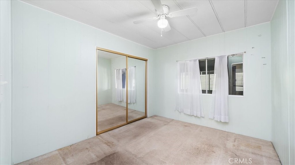 416 Jeffries, Unit 5 Monrovia, CA 91016 - Photo 16 of 20 en empty room with windows and ceiling fan