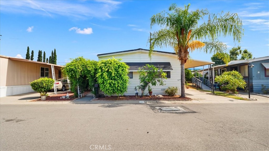 416 Jeffries, Unit 5 Monrovia, CA 91016 - Photo 2 of 20 a view of a patio with a table and chairs under an umbrella