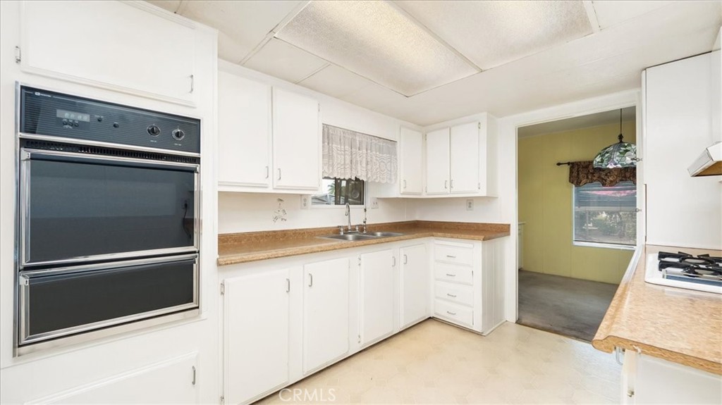 416 Jeffries, Unit 5 Monrovia, CA 91016 - Photo 6 of 20 a kitchen with granite countertop stainless steel appliances and cabinets