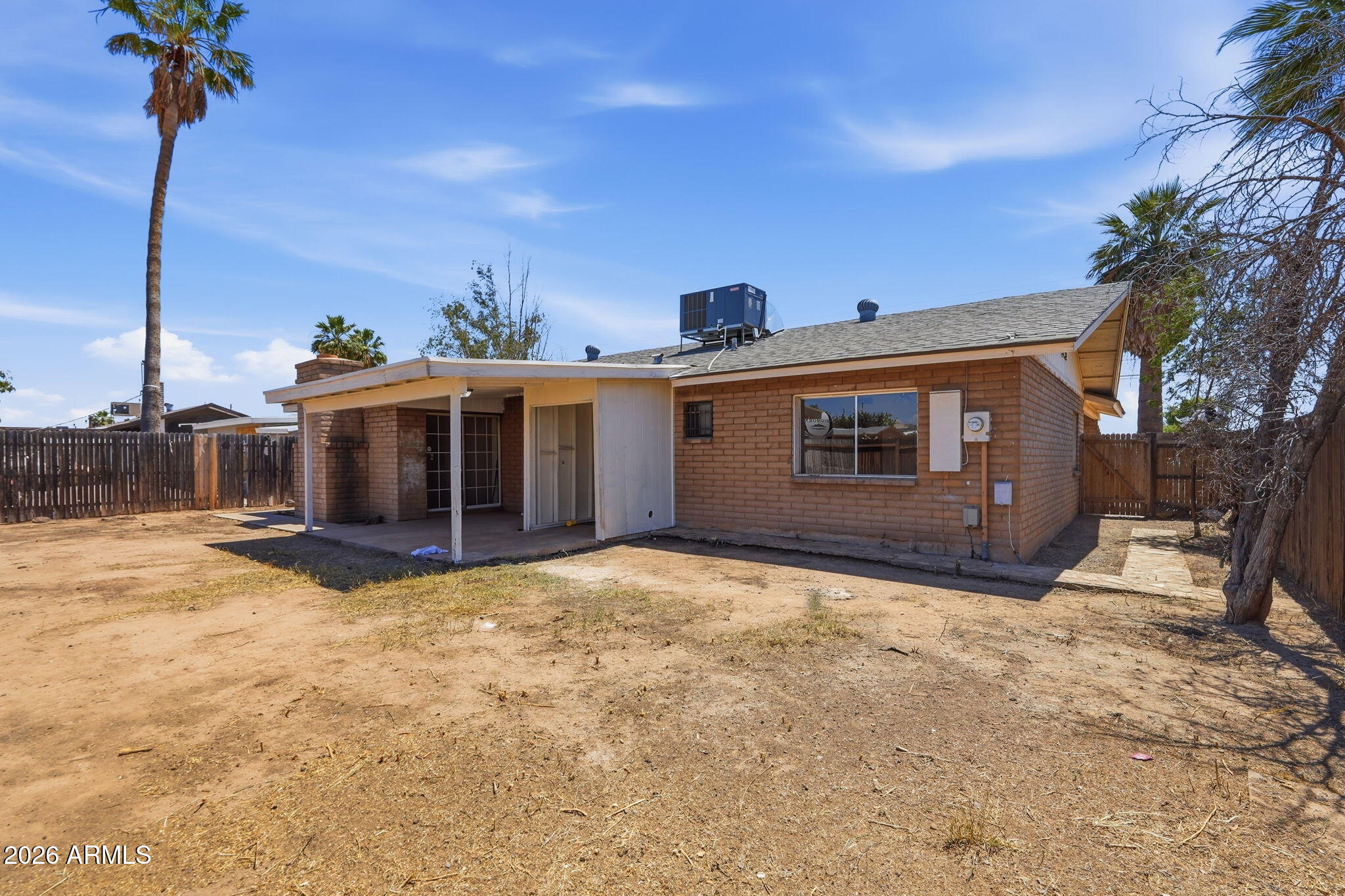 6452 West Thomas Road Phoenix, AZ 85033 - Photo 28 of 30 a view of a house with a yard