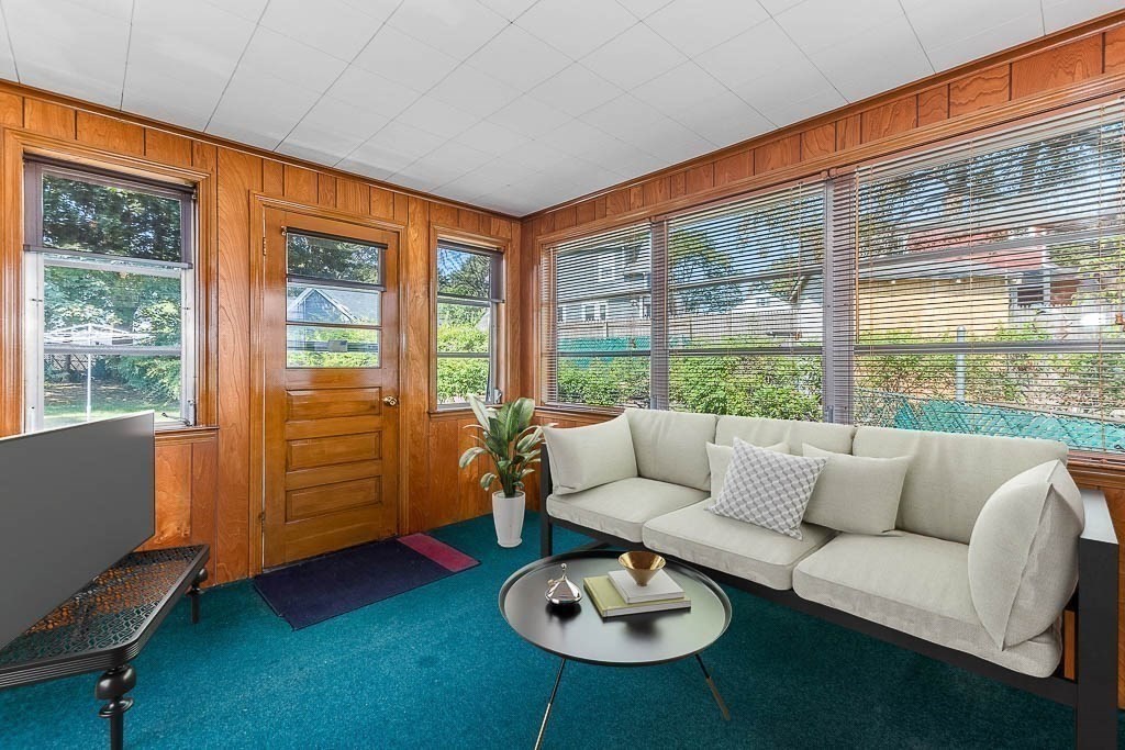 12 Juniper Terrace Dedham, MA 02026 - Photo 16 of 41 a living room with furniture and a table