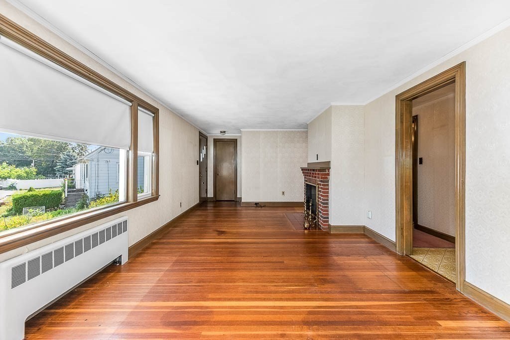 12 Juniper Terrace Dedham, MA 02026 - Photo 8 of 41 a view of a hallway with wooden floor and staircase