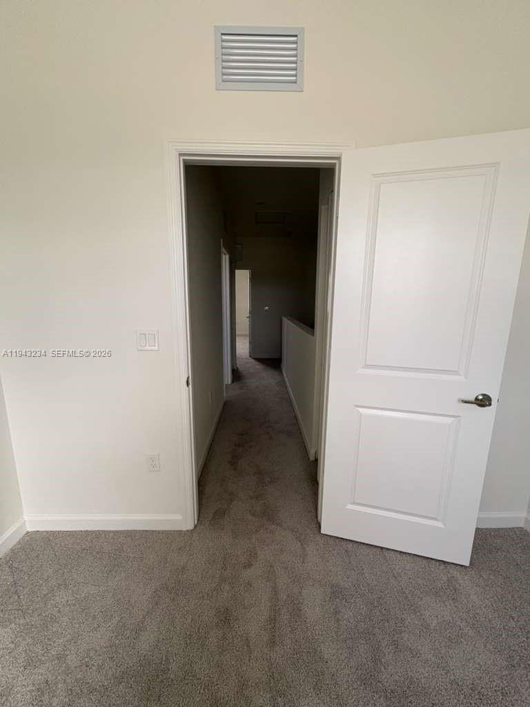 35663 Southwest 178th Court Homestead, FL 33034 - Photo 11 of 23 a view of a hallway to rooms
