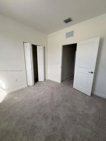 wooden floor and closet in a room