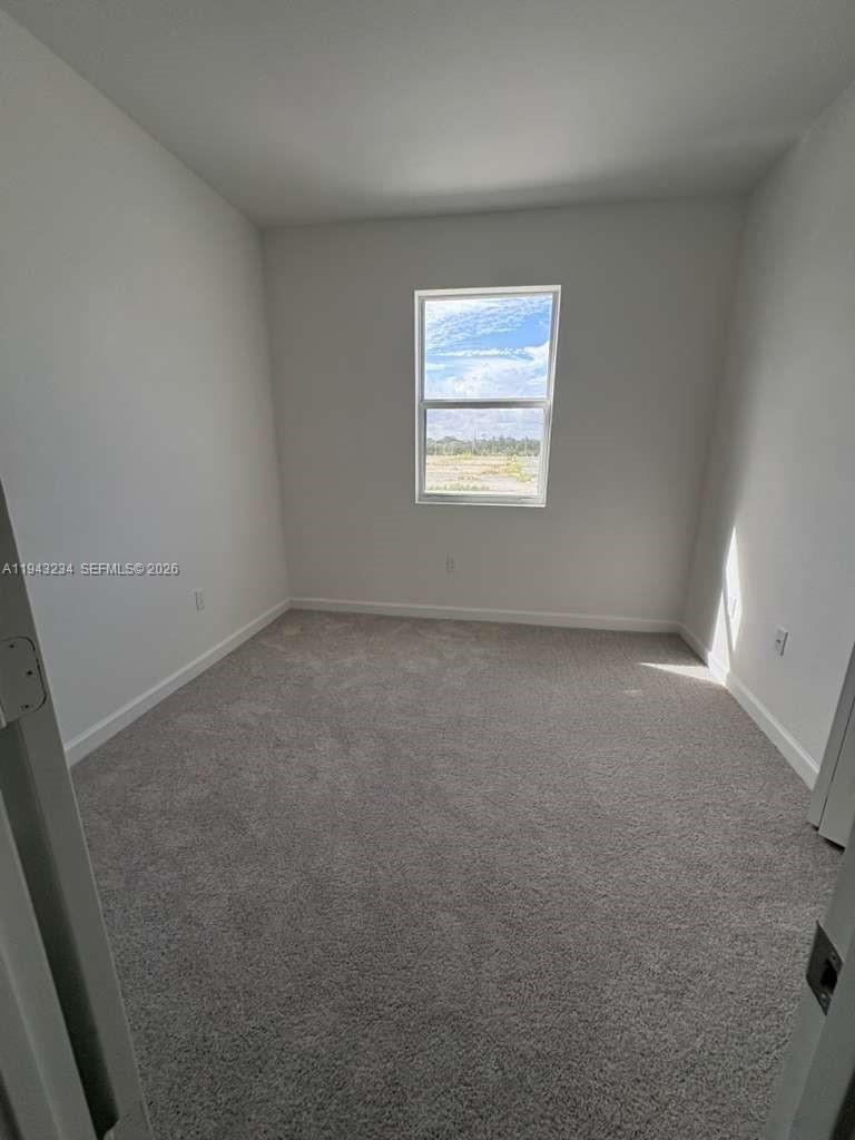 35663 Southwest 178th Court Homestead, FL 33034 - Photo 20 of 23 an empty room with a window