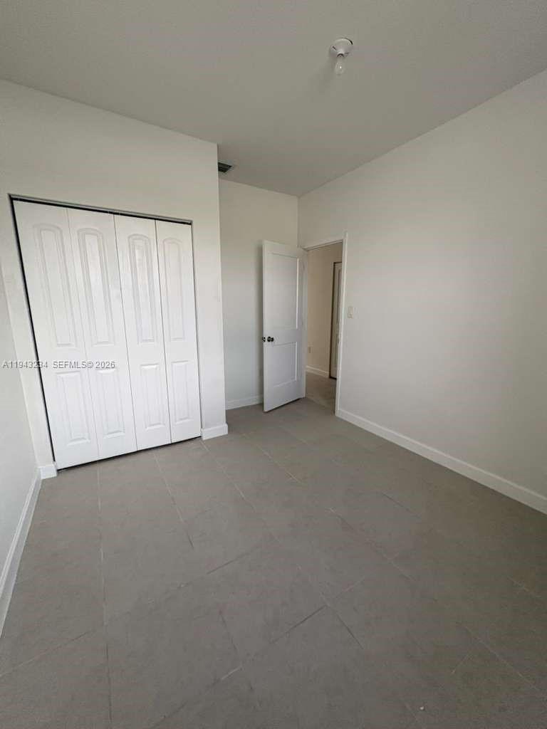35663 Southwest 178th Court Homestead, FL 33034 - Photo 21 of 23 a view of an empty room and a window